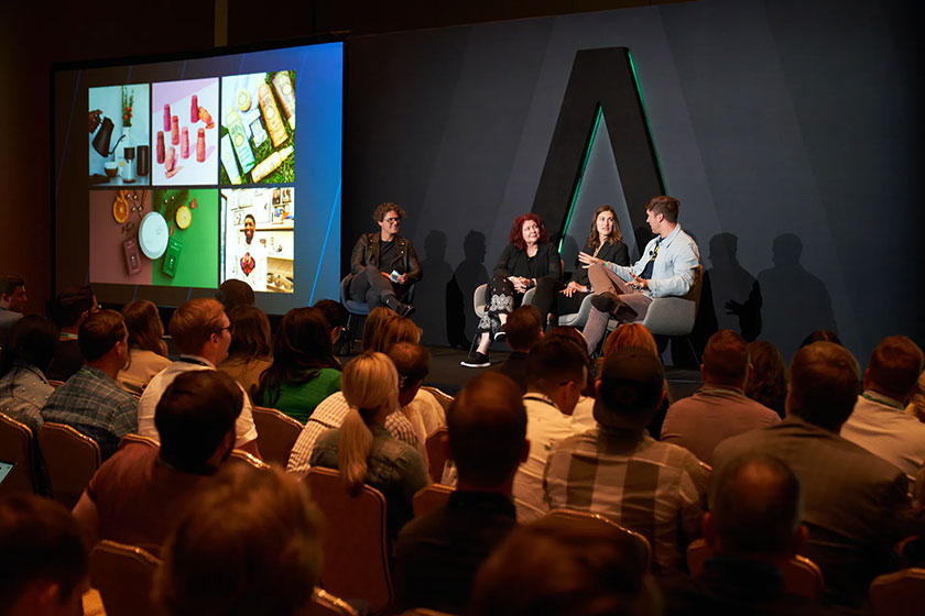 people talking on a stage